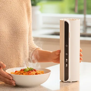 TempTray in use on a kitchen counter next to a bowl of pasta, steam visible